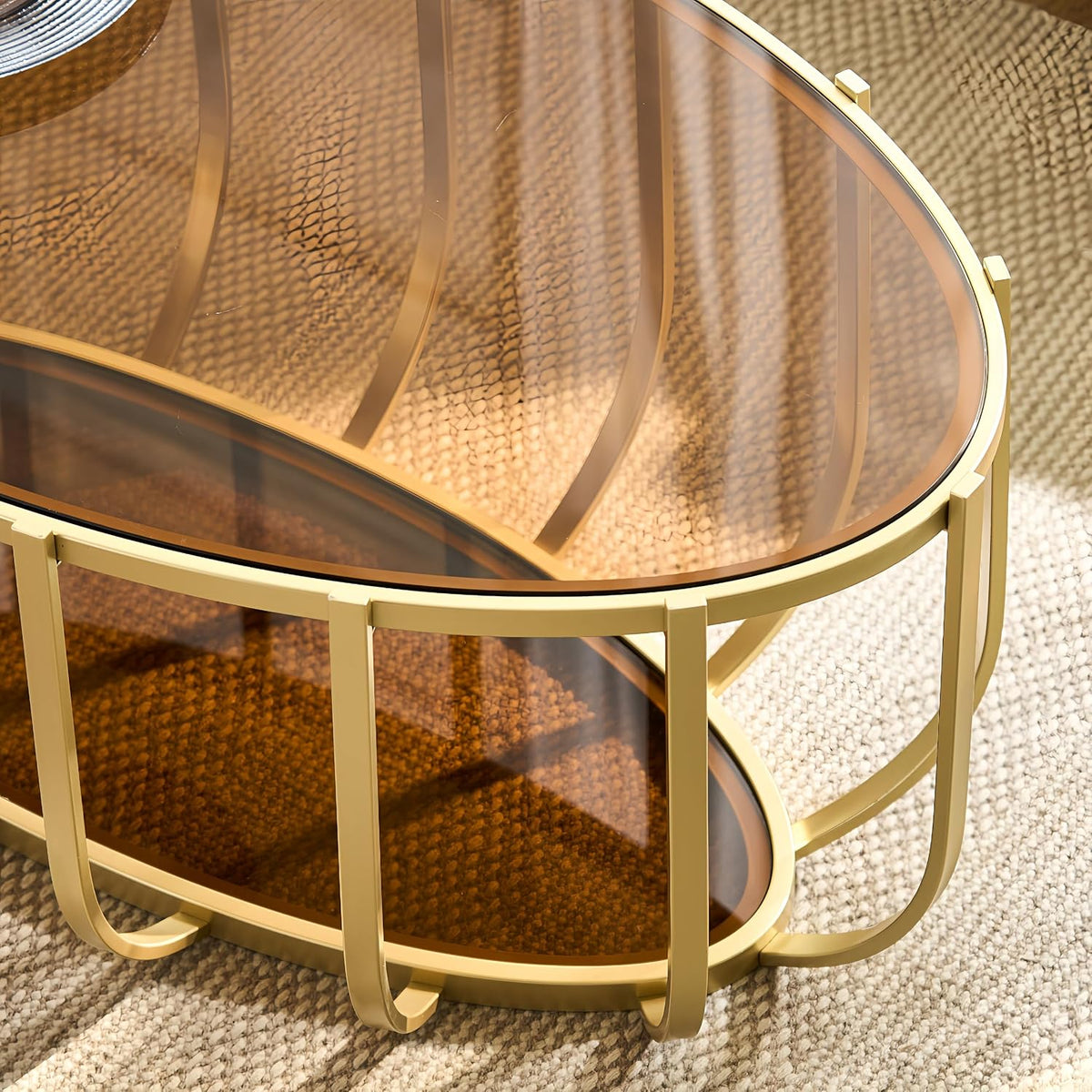 Shrine Gold Oval Glass Coffee Table, Mid-Century Modern Design, 2-Tier Structure, Brown Glass Top and Shelf, 42.5' D x 22.8' W x 16.5' H, Glam Gold Metal Cage-Frame